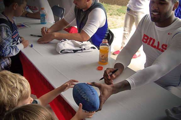 Bills Rookie QB, E.J. Manuel signs Cam's blue football—with a personalized birthday message!