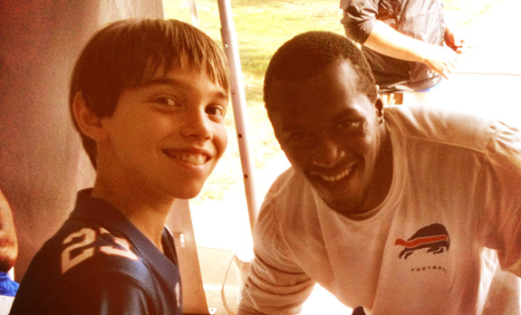 Bills DB, Leodis McKelvin, posing for a photo with Alex (and signing his autograph book)